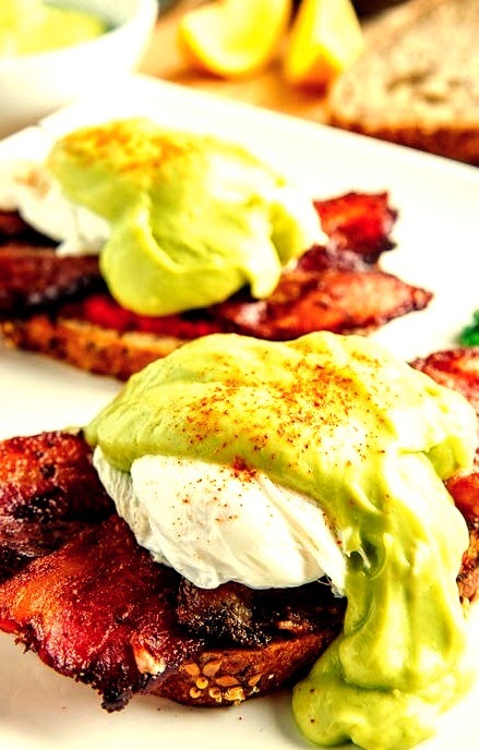 Eggs Benedict with Bacon, Avodaise (Avocado Hollandaise) and Harissa (via http
